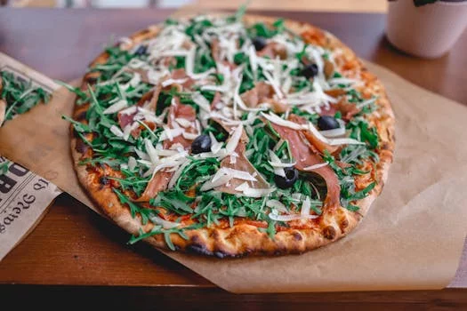 prosciutto and arugula gourmet pizza